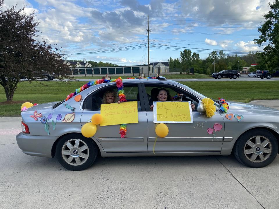 Family members and loved ones of Brookstone residents adorned their vehicles with signs and decorations before driving past the center. (Photo: Jenny Brinkle)