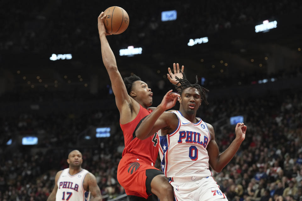 Toronto Raptors' Scottie Barnes shoots over Philadelphia 76ers' Tyrese Maxey during the first half of an NBA basketball game Saturday, Oct. 28, 2023, in Toronto. (Chris Young/The Canadian Press via AP)