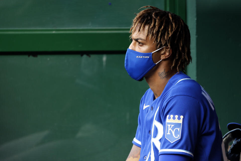 Kansas City Royals' Adalberto Mondesi sits in the dugout during an intrasquad baseball scrimmage at Kauffman Stadium on Wednesday, July 15, 2020, in Kansas City, Mo. (AP Photo/Charlie Riedel)