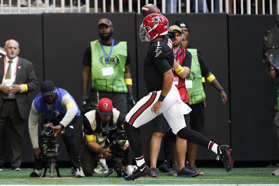 Atlanta Falcons quarterback Marcus Mariota (1) runs into the end zone for a touchdown against the San Francisco 49ers during the first half of an NFL football game, Sunday, Oct. 16, 2022, in Atlanta. (AP Photo/Brynn Anderson)