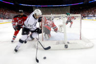 NEWARK, NJ - JUNE 02: Dustin Brown #23 of the Los Angeles Kings handles the puck as Peter Harrold #10 of the New Jersey Devils gives chase during Game Two of the 2012 NHL Stanley Cup Final at the Prudential Center on June 2, 2012 in Newark, New Jersey. (Photo by Paul Bereswill REMOTE/Getty Images)