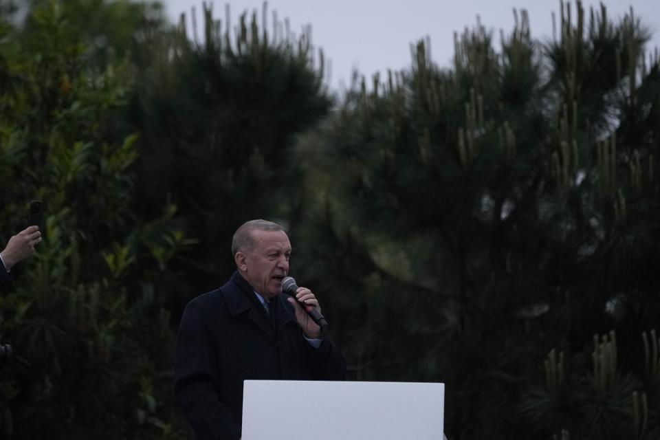 President Recep Tayyip Erdogan delivers a speech to supporters outside his residence in Istanbul, Turkey, Sunday, May 28, 2023. Turkey's incumbent President Recep Tayyip Erdogan has declared victory in his country's runoff election, extending his rule into a third decade. (AP Photo/Francisco Seco)