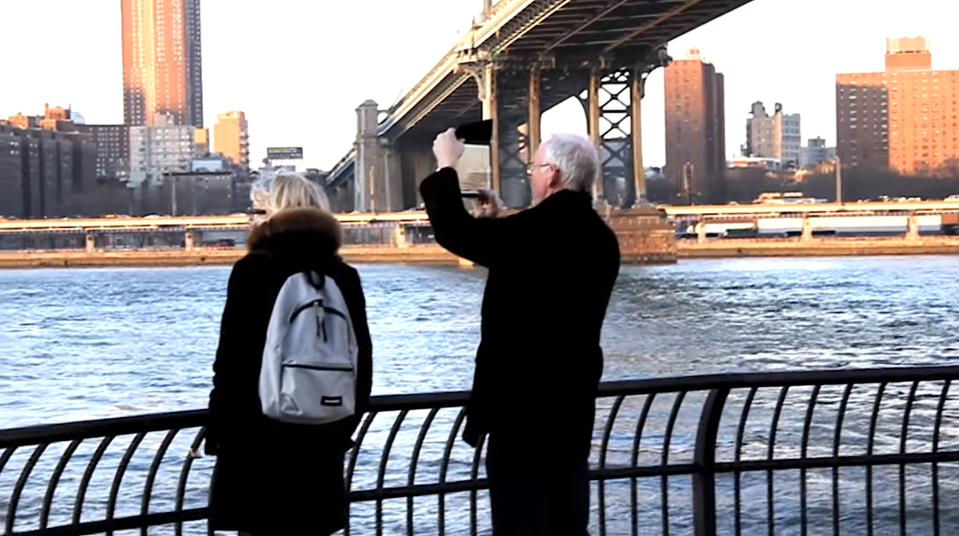 A couple recording the flying people