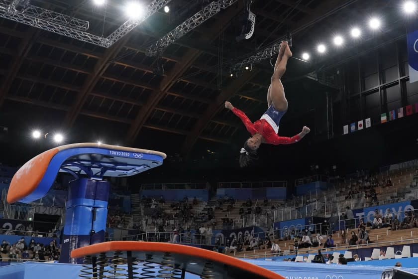 Simone Biles, of the United States, performs on the vault during the artistic gymnastics women's final at the 2020 Summer Olympics, Tuesday, July 27, 2021, in Tokyo. (AP Photo/Ashley Landis)