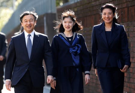 FILE PHOTO: Japan's Princess Aiko, accompanied by her parents Crown Prince Naruhito and Crown Princess Masako, arrives at her graduation ceremony at the Gakushuin Girls' Junior High School in Tokyo
