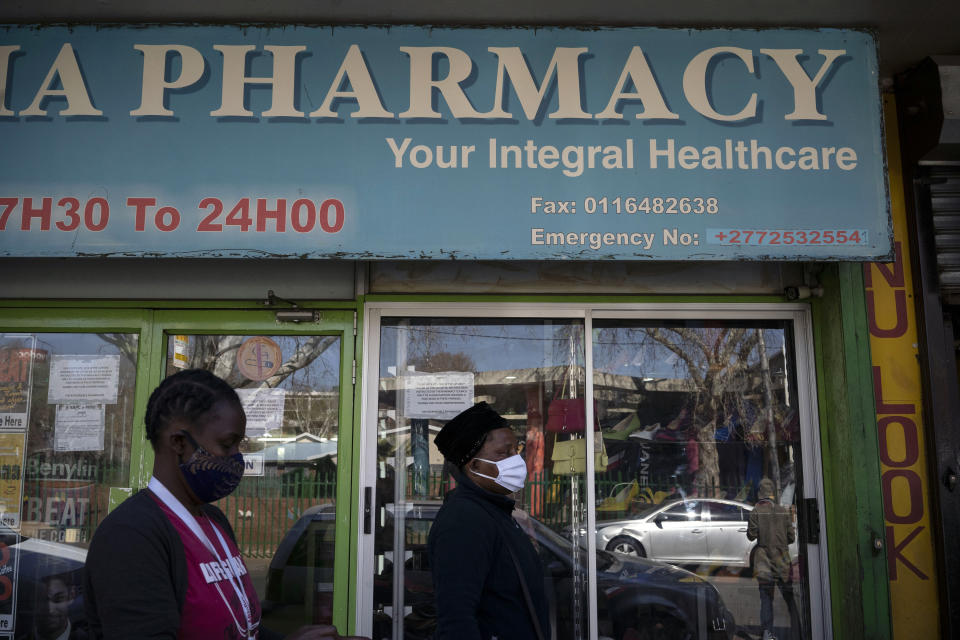 Sister Sylvia Simpwalo, right, leaves the pharmacy where she bought HIV medication for her patients in downtown Johannesburg, South Africa, Thursday, July 30, 2020. Across Africa and around the world, the COVID-19 pandemic has disrupted the supply of antiretroviral drugs to many of the more than 24 million people who take them, endangering their lives. An estimated 7.7 million people in South Africa are HIV positive, the largest number in the world, and 62% of them take the antiretroviral drugs that suppress the virus and prevent transmission. (AP Photo/Bram Janssen)