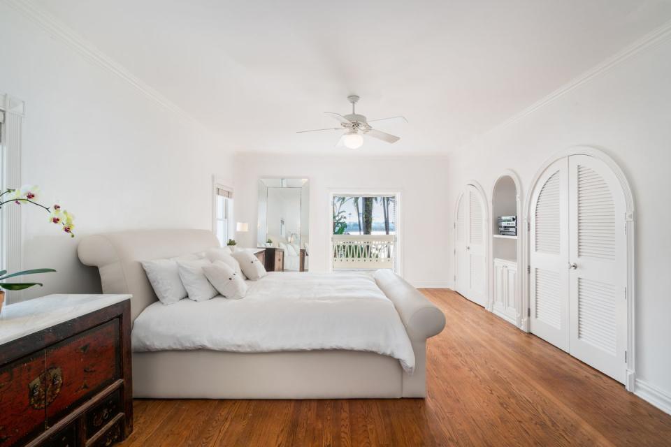 <p>The second-floor master suite is one of five bedrooms, and features a sweeping private veranda that overlooks the backyard. </p>