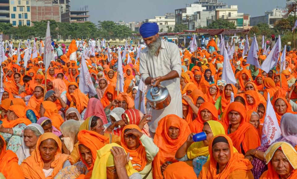 Women from the farming community raise slogans as they take part in the ongoing farmers agitation, against the central governments newly introduced agri-bills, in Amritsar, Friday, 23 October, 2020. Farmers from across the state are demanding a rollback in three agri-bills of the central government and against the new Electricity Bill 2020, stating that these are against the interests of the farmers.