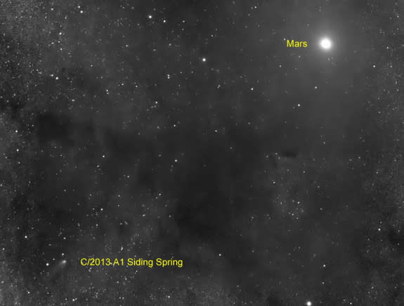 The Comet Siding Spring (C/2013 A1) is seen near Mars on Oct. 19, 2014 by a telescope with the Slooh Community Observatory during a rare flyby that scientists called a once-in-a-lifetime event. The comet flew within 87,000 miles of the surface