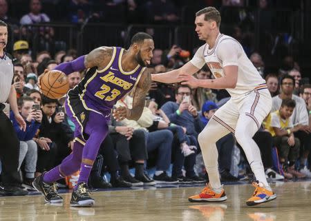 FILE PHOTO: Mar 17, 2019; New York, NY, USA; Los Angeles Lakers forward LeBron James (23) drives past New York Knicks forward Mario Hezonja (8) in the fourth quarter at Madison Square Garden. Mandatory Credit: Wendell Cruz-USA TODAY Sports