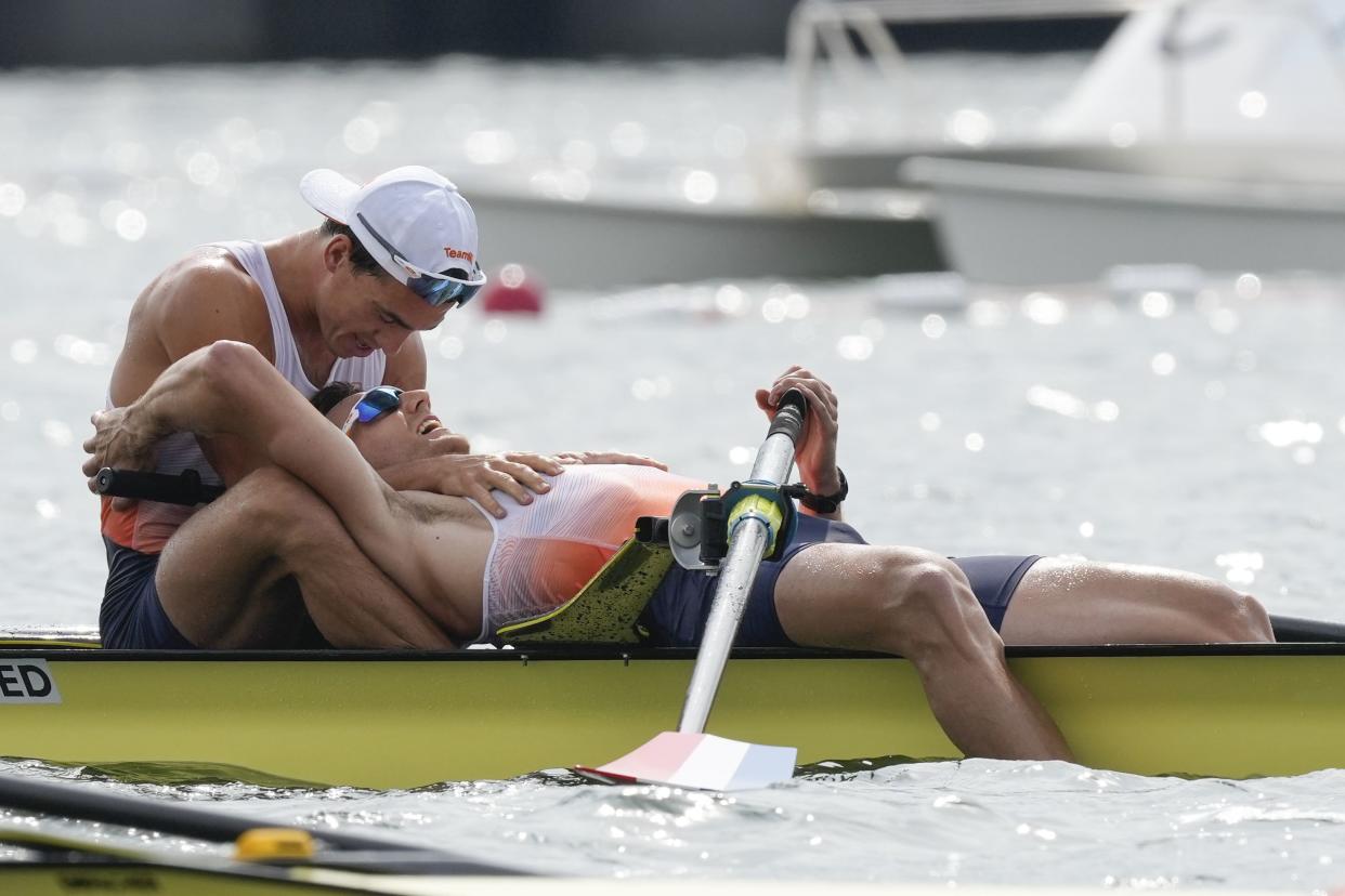 Niki van Sprang and Guillaume Krommenhoek of the Netherlands react after competing in the men's rowing pair final at the 2020 Summer Olympics, Thursday, July 29, 2021, in Tokyo, Japan.