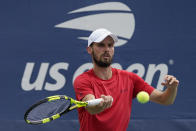 Oscar Otte, of Germany, returns a shot to Lorenzo Sonego, of Italy, during the first round of the US Open tennis championships, Tuesday, Aug. 31, 2021, in New York. (AP Photo/Seth Wenig)