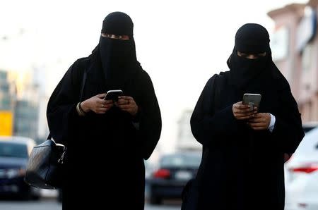 Saudi women use the Careem app on their mobile phones in Riyadh, Saudi Arabia, January 2, 2017. REUTERS/Faisal Al Nasser/Files