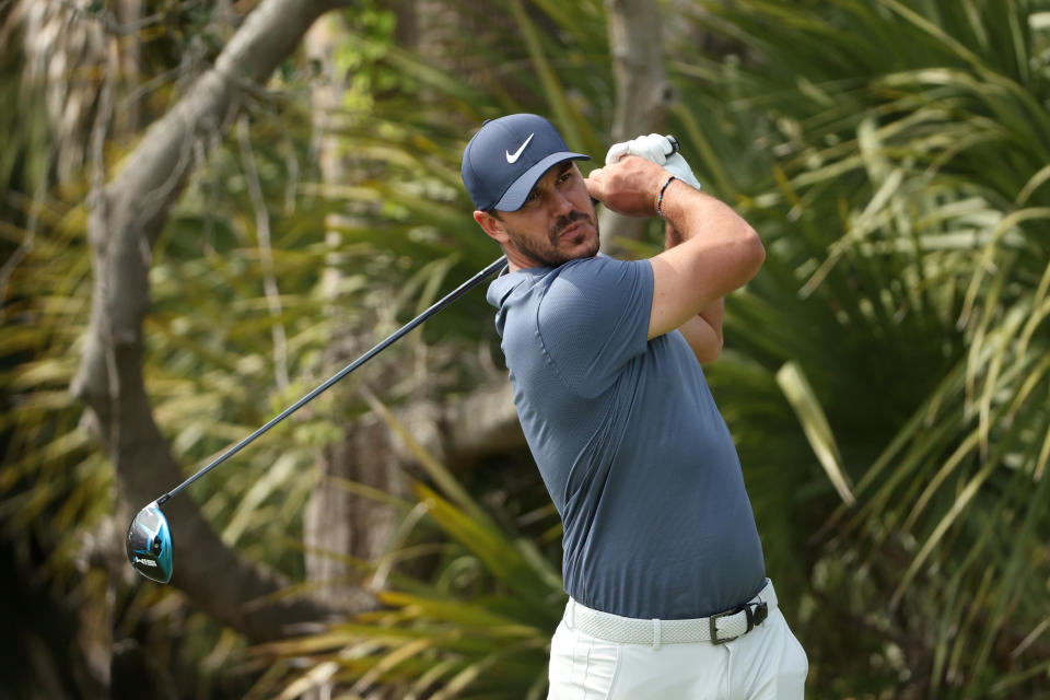 Brooks Koepka plays a shot during a practice round prior to the 2021 PGA Championship