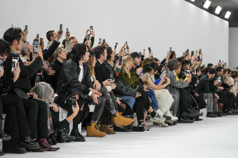 Audience members watch the Viktor&Rolf Haute Couture Spring-Summer 2024 collection presented in Paris, Wednesday, Jan. 24, 2024. (AP Photo/Thibault Camus)