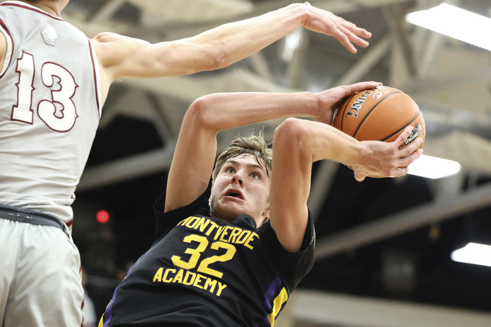 FILE - Monteverde's Cooper Flagg plays against Sunrise Christian during a high school basketball game at the Hoophall Classic, Monday, Jan. 16, 2023, in Springfield, Mass. Cooper Flagg, the consensus top player in the 2024 recruiting class, says his focus is on the tragedy of a mass shooting in his home state of Maine, an indication that an announcement on where he will play college basketball could be delayed. The 6-foot-9 small forward has been deciding between Duke and defending national champion UConn. There were reports he would announce his decision Thursday, Oct. 26.(AP Photo/Gregory Payan, File)