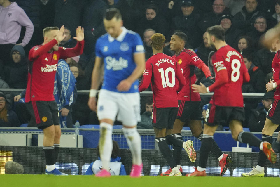 Manchester United's Anthony Martial celebrates with his teammates after scoring his side's third goal during the English Premier League soccer match between Everton and Manchester United, at Goodison Park Stadium, in Liverpool, England, Sunday , Nov. 26, 2023. (AP Photo/Jon Super)