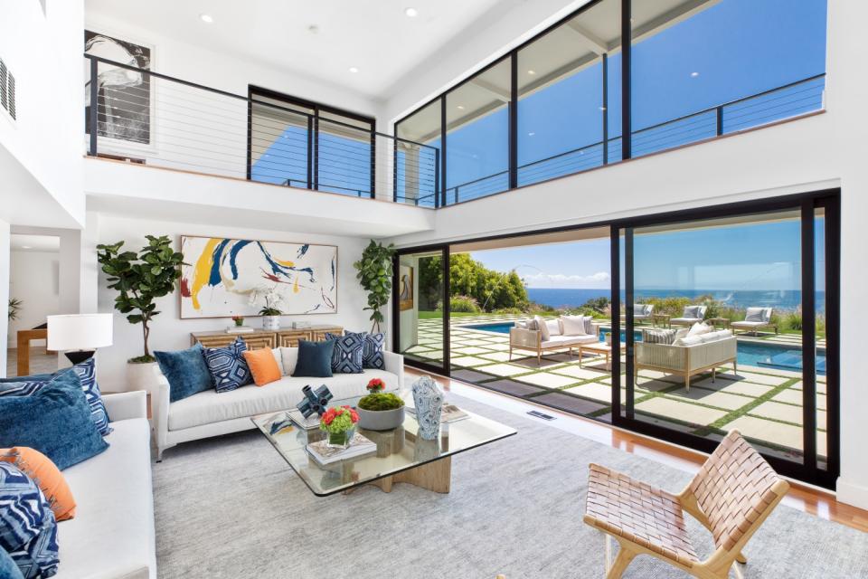 The contemporary-style house faces a beach where "The Wild, Wild West" actor learned to surf in the 1950s.