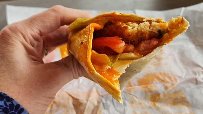 eating a Fiery Buffalo Royal Crispy Wrap