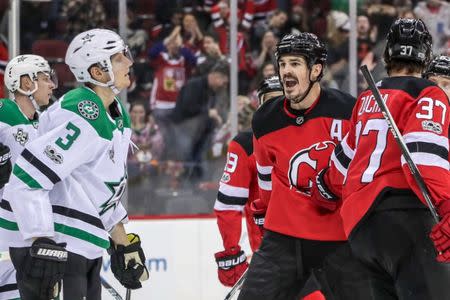 Dec 15, 2017; Newark, NJ, USA; New Jersey Devils center Brian Boyle (11) has words with Dallas Stars defenseman John Klingberg (3) after scoring a goal during the second period at Prudential Center. Mandatory Credit: Vincent Carchietta-USA TODAY Sports