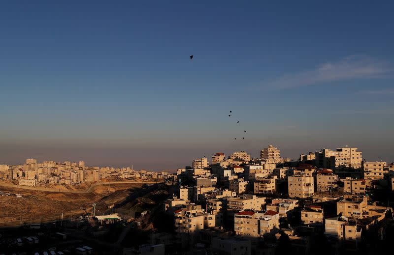 FILE PHOTO: A general view picture shows the Issawiya neighbourhood and the Israeli barrier running along the Shuafat refugee camp in East Jerusalem, in an area Israel annexed to Jerusalem after capturing it in the 1967 Middle East war