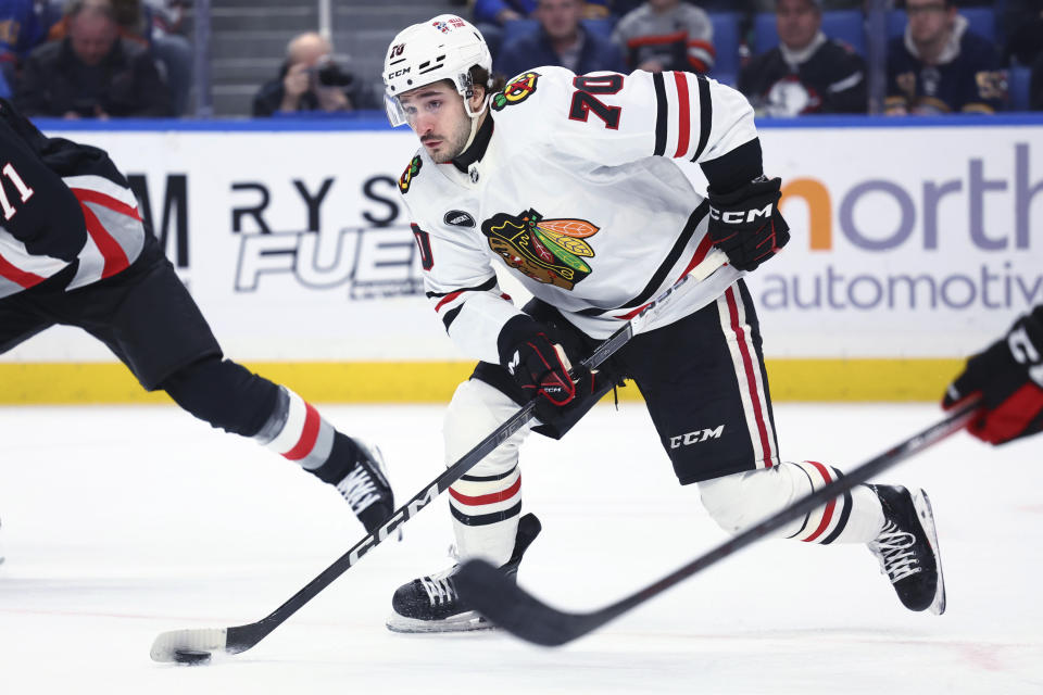 Chicago Blackhawks center Cole Guttman (70) skates with the puck during the first period of the team's NHL hockey game against the Buffalo Sabres on Thursday, Jan. 18, 2024, in Buffalo, N.Y. (AP Photo/Jeffrey T. Barnes)