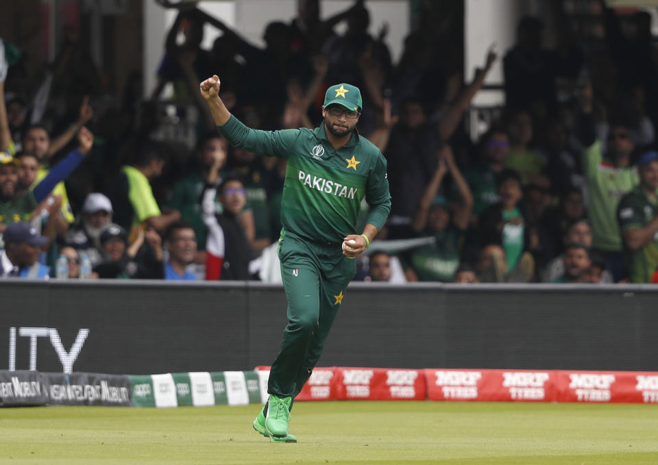 Pakistan's Imam-ul-Haq celebrates after taking a catch to dismiss South Africa's Quinton de Kock during their Cricket World Cup match between Pakistan and South Africa at Lord's cricket ground in London, Sunday, June 23, 2019. (AP Photo/Alastair Grant)