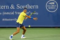 Aug 18, 2017; Mason, OH, USA; Rafael Nadal (ESP) returns a shot against Nick Kyrgios (AUS) during the Western and Southern Open at the Lindner Family Tennis Center. Mandatory Credit: Aaron Doster-USA TODAY Sports