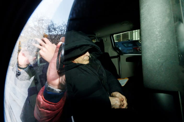 Seen through a police vehicle window, Canadian fashion mogul Peter Nygard leaves a Toronto courthouse in November 2023 after being found guilty of four counts of sexual assault (Cole BURSTON)