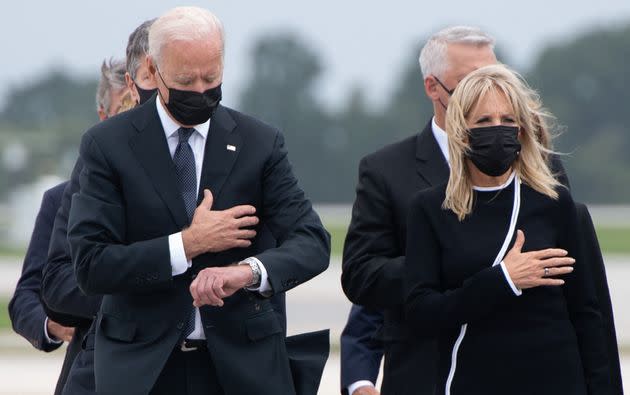 President Joe Biden and first lady Jill Biden attend the dignified transfer of the remains of a fallen service member at Dover Air Force Base in Delaware in 2021.