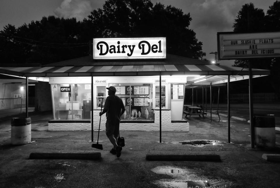 Dairy Del owner Kevin Lawhorn finished cleaning the parking lot before closing his ice cream shop for the night. The shop has been in business since 1951. June 21 , 2018.