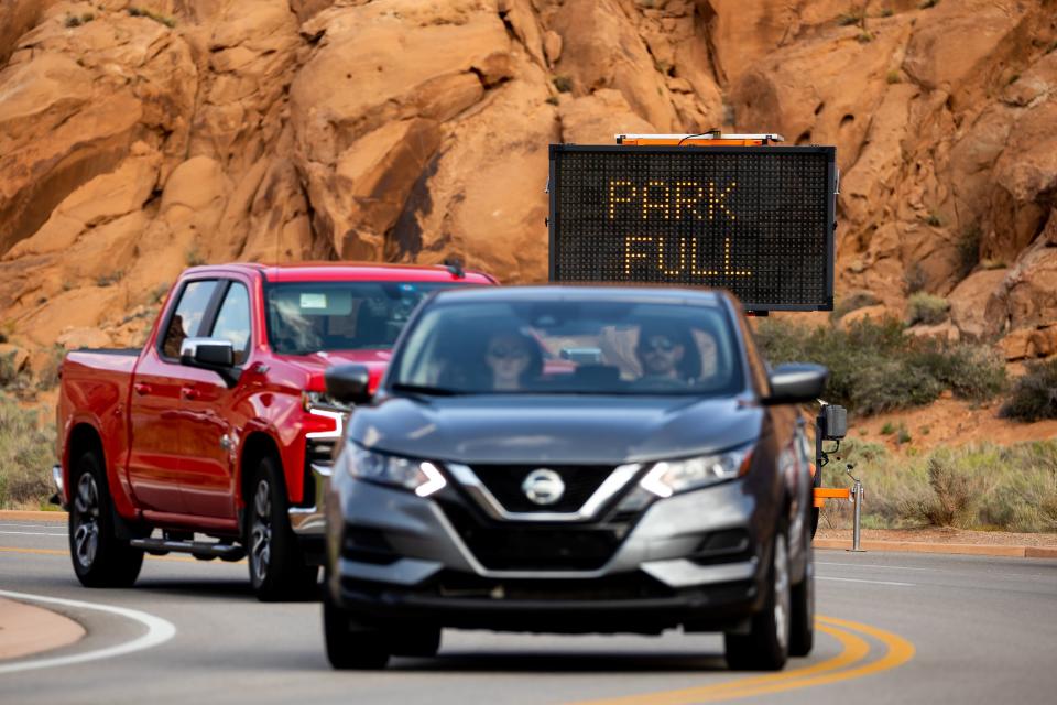 Signage warns approaching cars that Arches National Park is restricting additional entries due to crowding on Sunday, Sept. 19, 2021. | Spenser Heaps, Deseret News