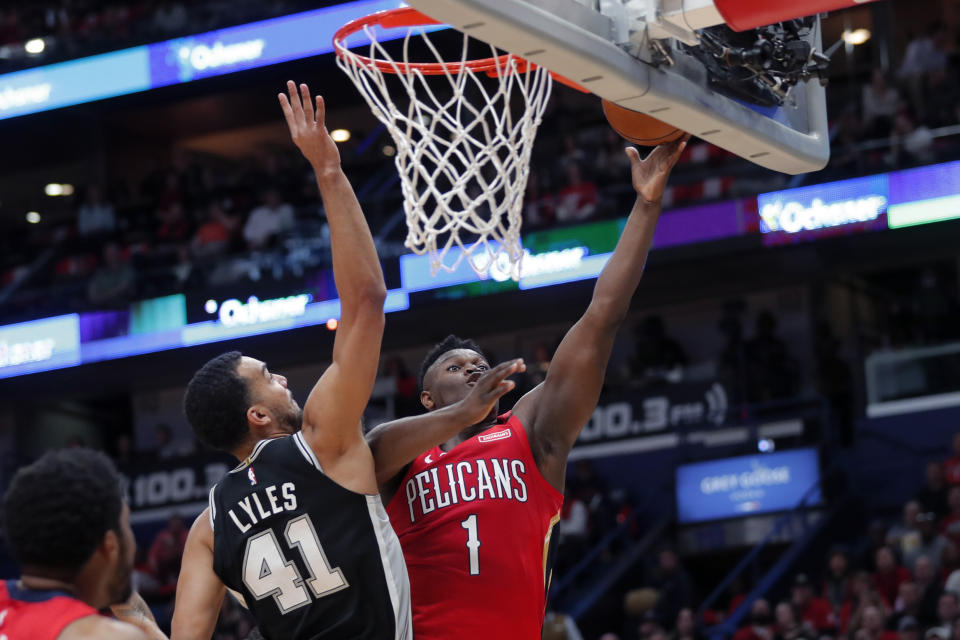 New Orleans Pelicans forward Zion Williamson (1) goes to the basket against San Antonio Spurs forward Trey Lyles (41) in the first half of an NBA basketball game in New Orleans, Wednesday, Jan. 22, 2020. (AP Photo/Gerald Herbert)