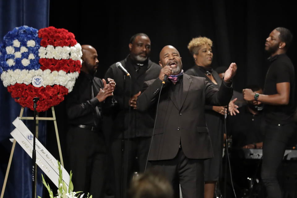 Minister Marvin Webb sings during a memorial service for Federal Protective Services Officer Dave Patrick Underwood on Friday, June 19, 2020, in Pinole, Calif. Underwood was fatally shot as he was guarding the Ronald V. Dellums Federal Building in Oakland, Calif., amid protests on May 29. (AP Photo/Ben Margot)