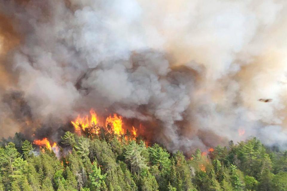 In this image released by the Ontario Ministry of Natural Resources and Forestry, the Sudbury 17 wildfire burns east of Mississagi Provincial Park near Elliot Lake, Ontario, on Sunday, June 4, 2023.