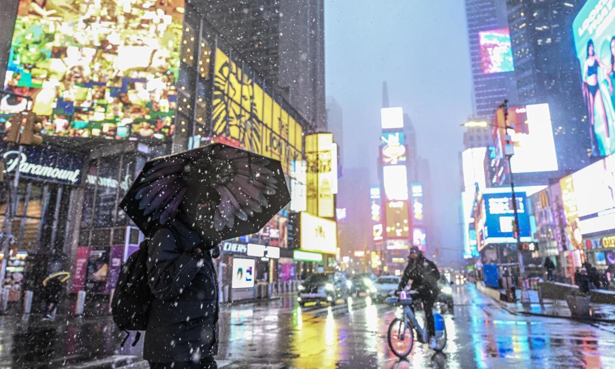 <span>Snowfall at Times Square, New York, in February. Buildings could draw heat from water pumped from below their foundations, instead of burning natural gas.</span><span>Photograph: Anadolu/Getty Images</span>