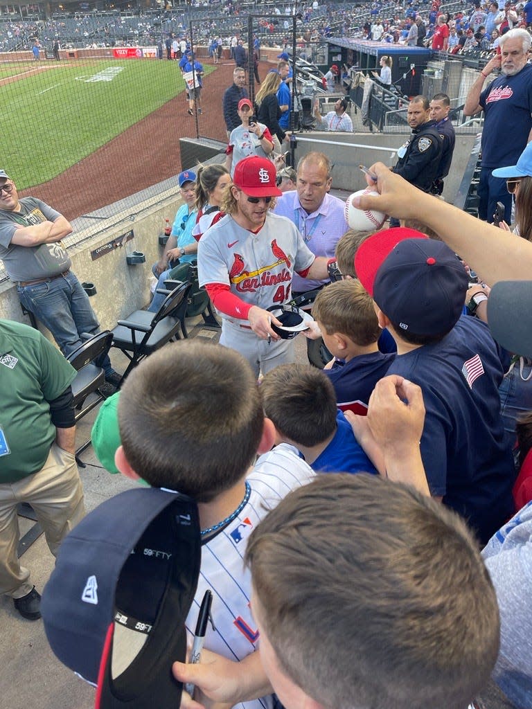 Harrison Bader, then with the St. Louis Cardinals, signs autographs for members of the Eastchester Little League between games of a doubleheader on May 17, 2022.