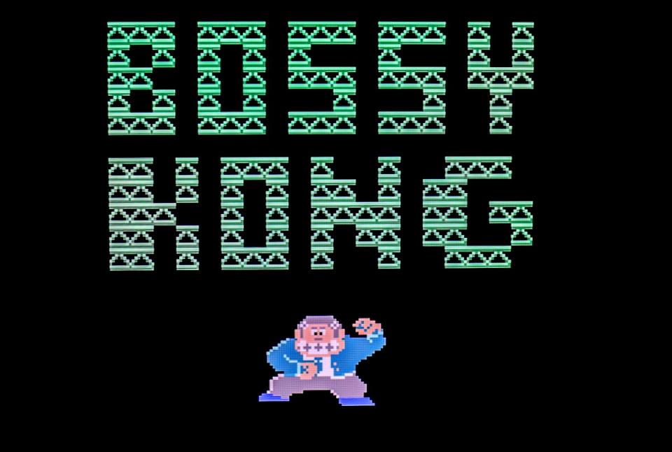 The title screen for "Bossy Kong," presented in all capital letters, and a small illustration of a monkey in a suit.