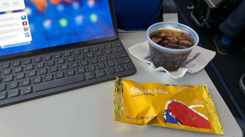 soda with snack on plane