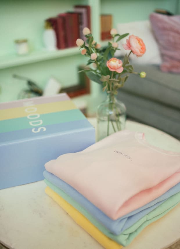 A stack of Moods Clothing's candy-colored sweatshirts.