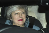 Britain's Prime Minister Theresa May leaves the Houses of Parliament in Westminster following a Brexit vote in the House of Commons, in London, Thursday Feb. 14, 2019. May suffered an embarrassing defeat by lawmakers Thursday in a vote that left her bid to secure a European Union divorce deal stuck between an intransigent EU and a resistant U.K. Parliament _ with Brexit just six weeks away. (Dominic Lipinski/PA via AP)