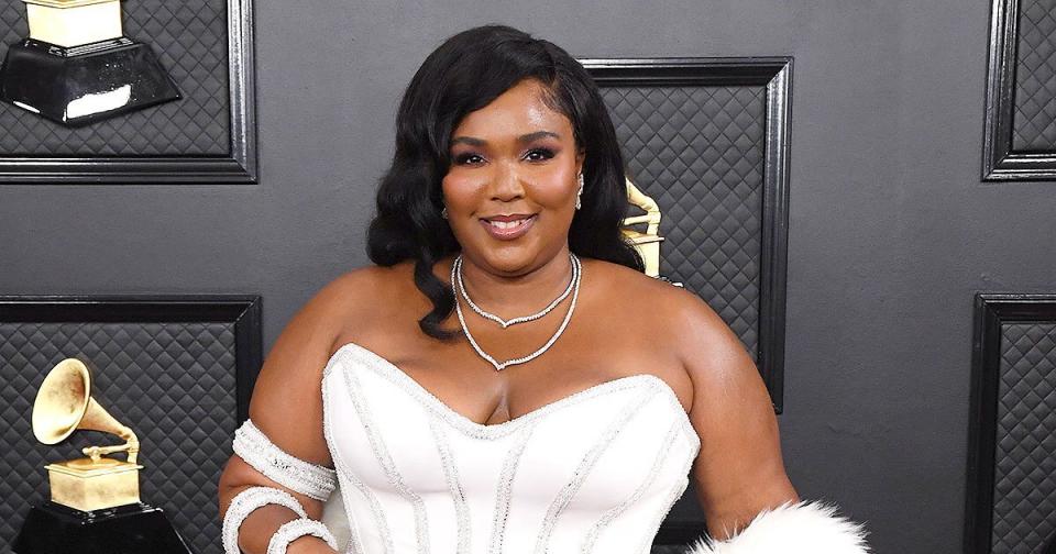 Lizzo Makes an Elegant Entrance at the 2020 Grammys in White Gown and Fur Boa