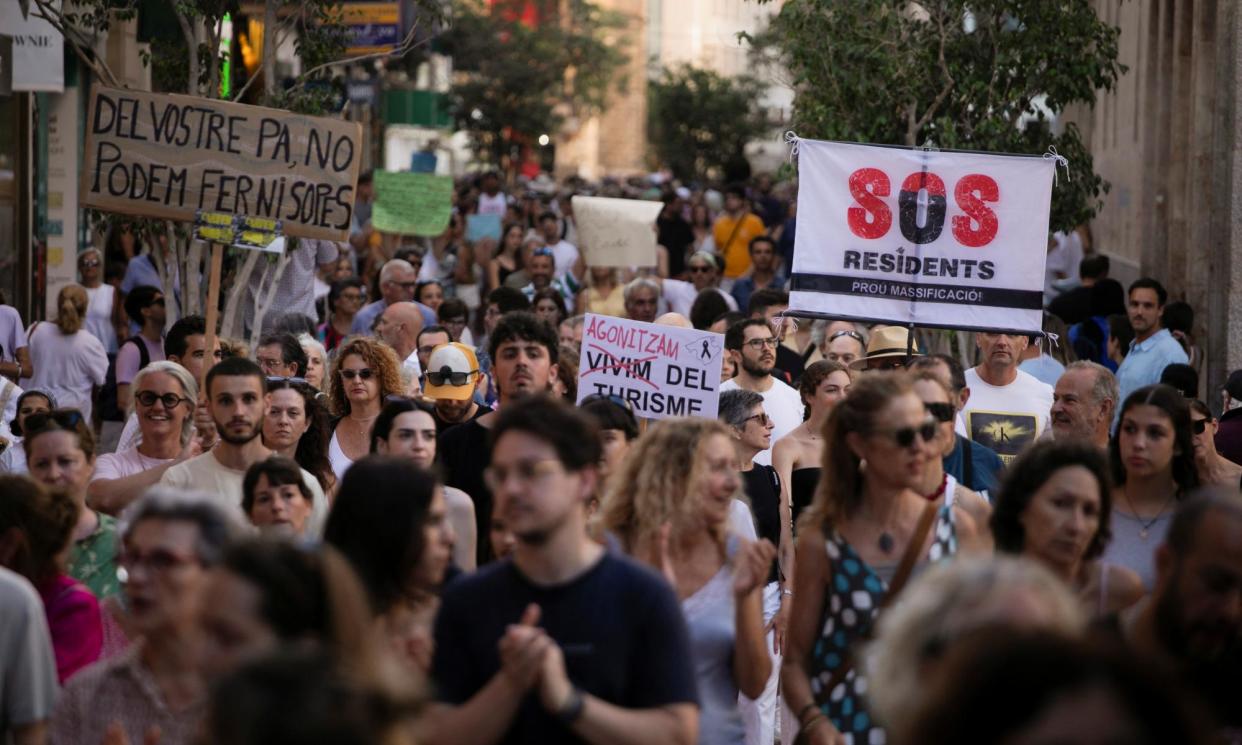 <span>People protest against mass tourism on the island of Mallorca, July 2024.</span><span>Photograph: Reuters</span>