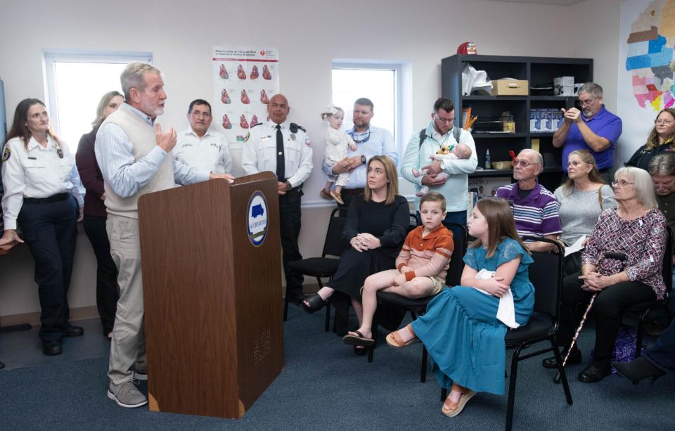 Richard McCool, 67, left, thanks those who helped save his life during a gathering at the Lifeguard Ambulance Station in Milton on Friday, Feb. 3, 2023. First responders, along with a personal trainer and gym attendees, helped save McCool’s life when he suffered cardiac arrest while working out at a Milton gym in Dec. 2022