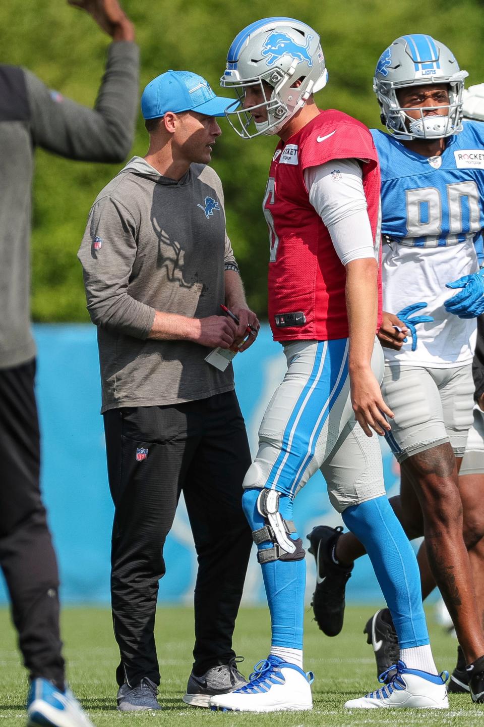 Detroit Lions quarterback Jared Goff talks to offensive coordinator Ben Johnson during joint practice with New York Giants at Detroit Lions headquarters and training facility in Allen Park on Tuesday, August 8, 2023.