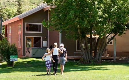Kelly Pfaff walks back to her house with her children after playing soccer in Park City