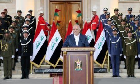 Iraqi Prime Minister Haider al-Abadi delivers a speech in Baghdad, Iraq, December 9, 2017. Iraqi Prime Minister Media Office/Handout via REUTERS