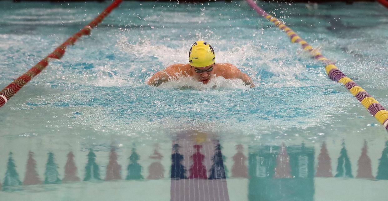 Bainbridge's Curtis Stewart, shown earlier this season, above, and the Spartans took first at the Class 3A West Central District boys swim/dive championships on Feb. 4. (Kitsap Sun file photo)