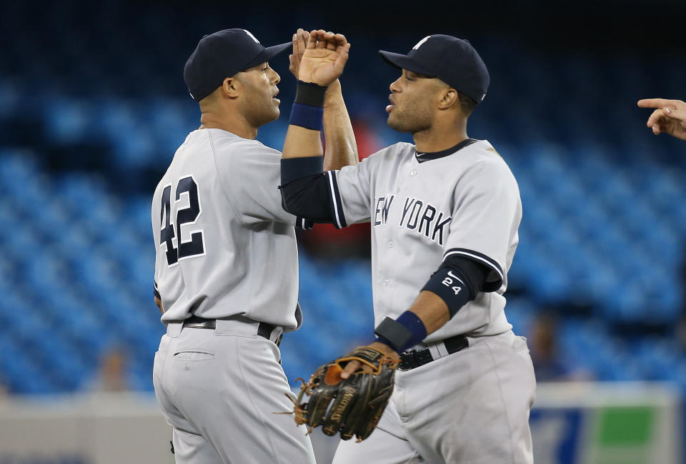 Former Yankees teammates Mariano Rivera and Robinson Canó, pictured here in 2013, are taking their talents to Dubai. (Tom Szczerbowski/Getty Images)