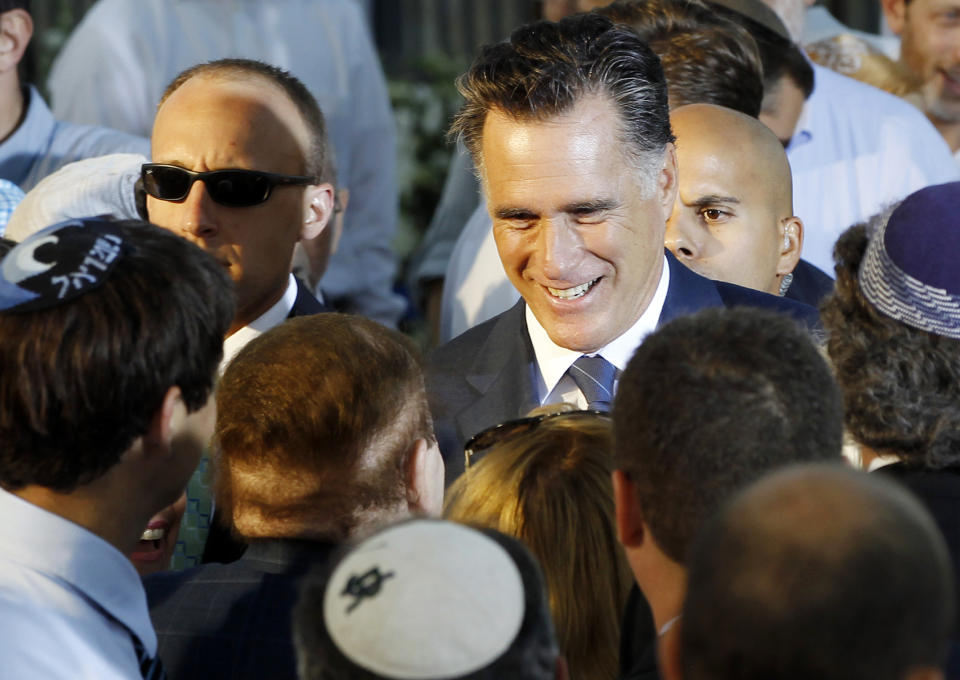 Republican presidential candidate and former Massachusetts Gov. Mitt Romney talks to American businessman Sheldon Adelson, who has said he will donate millions to Romney's campaign, after he delivered a speech in Jerusalem, Sunday, July 29, 2012. (AP Photo/Charles Dharapak)